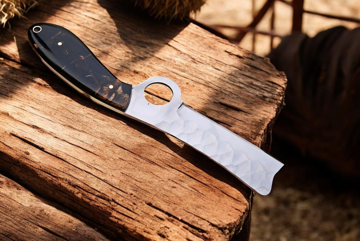 Custom handmade bull cutter knife with an exotic wood handle, featuring a Damascus Knife Store logo on the blade.