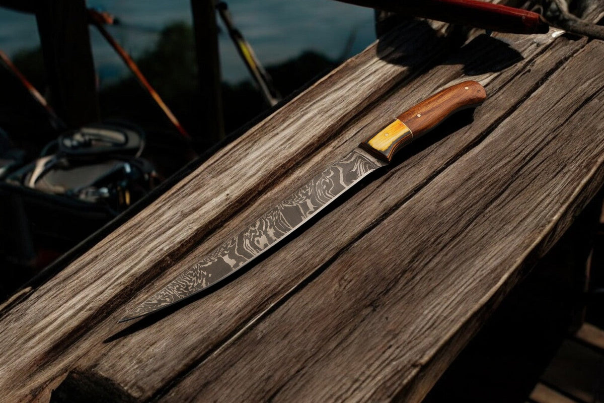 Damascus Knife Store 12.5-inch handmade Damascus fillet knife with a sleek, sharp blade for precise fish filleting.