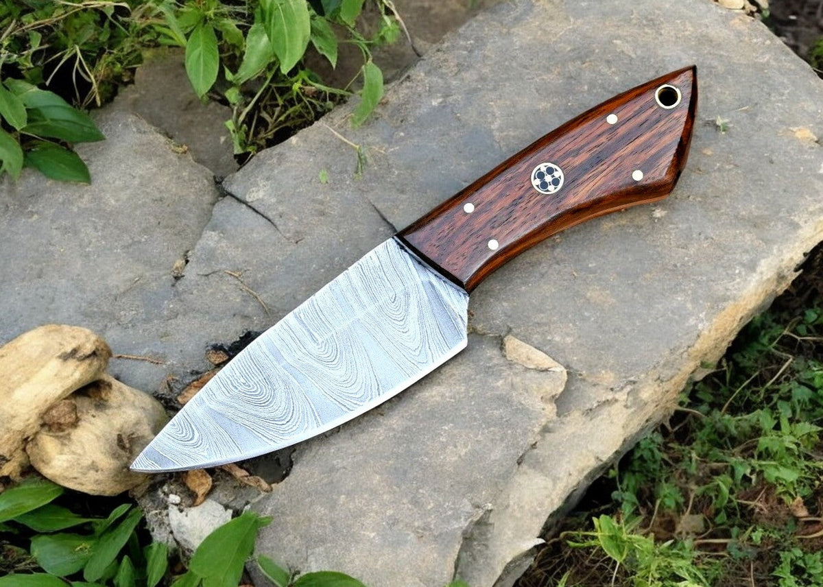 Handmade Damascus hunting knife with a polished rosewood handle and intricate Damascus steel blade.