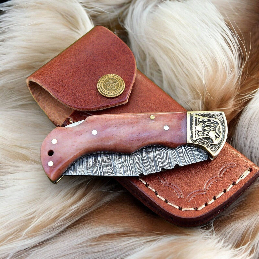 Custom handmade Damascus Steel pocket clip knife with a 3-inch blade, featuring intricate steel pattern and ergonomic design.