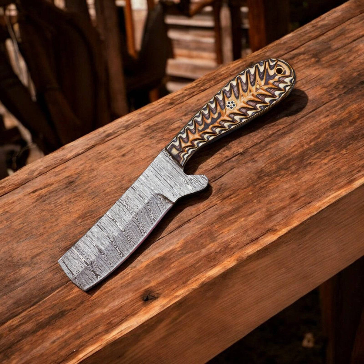 Custom handmade bull cutter knife with high carbon steel blade from Damascus Knife Store, featuring a detailed leather handle.
