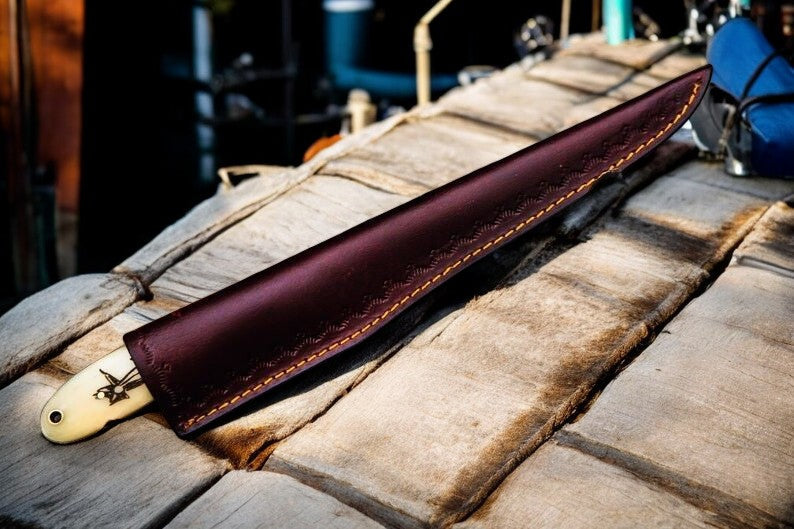 Handmade 13-inch Damascus fillet knife with bone and wood handle, showcasing a polished Damascus steel blade and ergonomic handle design.