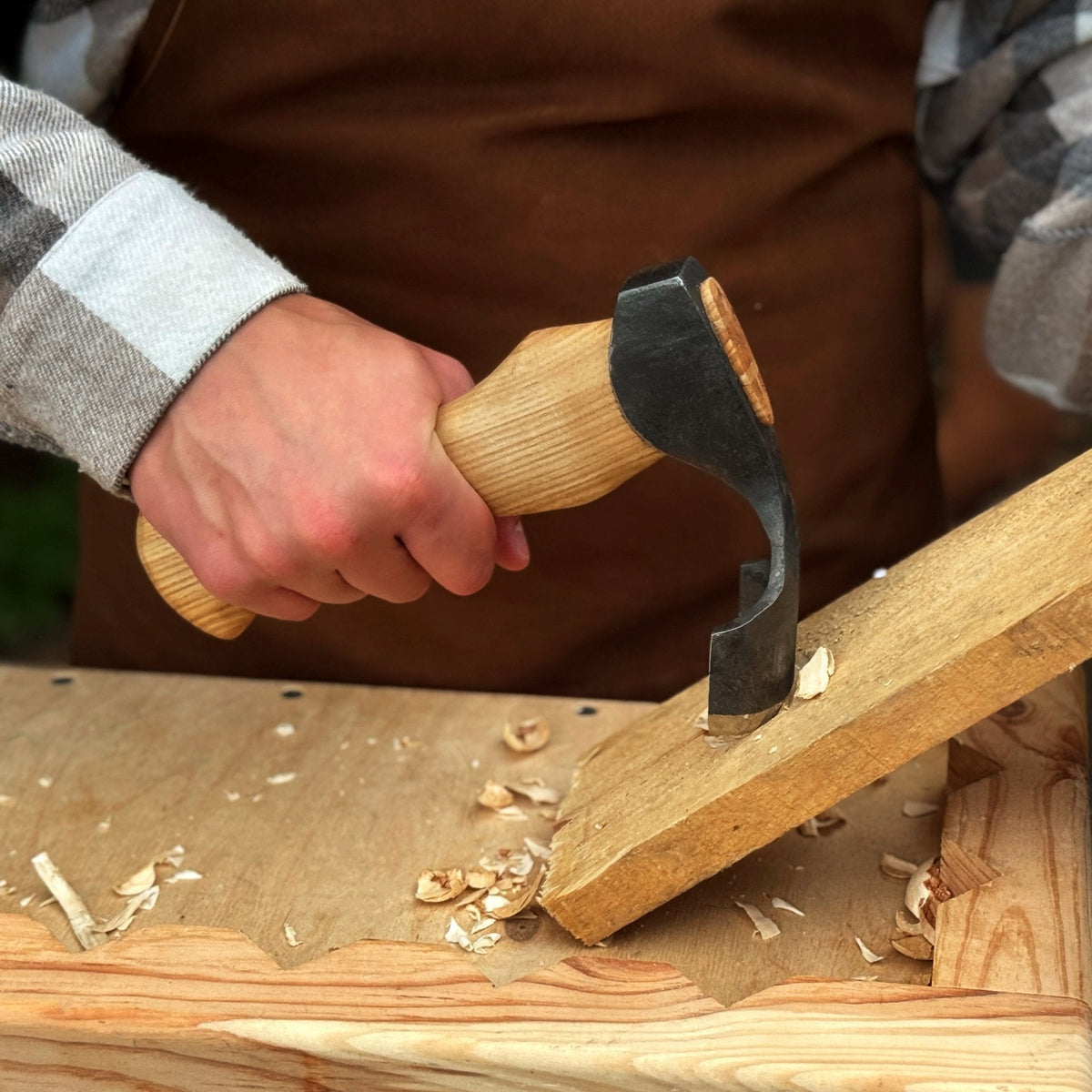 Small Kuksa adze with deep curved round blade from Sharky Forged Steel Tools, showcasing its compact design and craftsmanship.