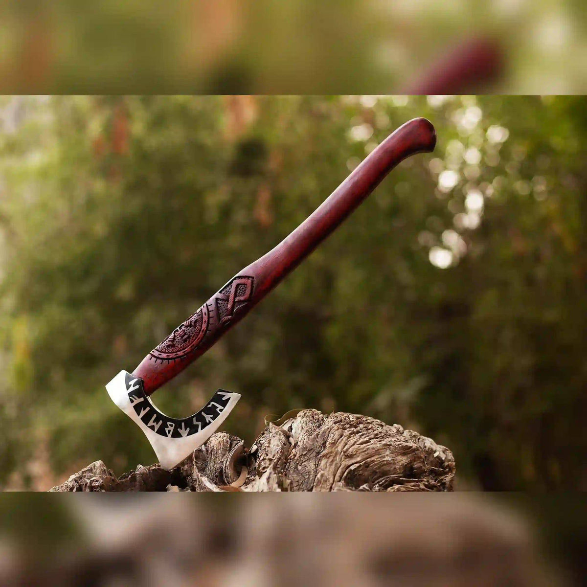 Runic Viking axe with carved red ash handle and bearded head, handcrafted from 1075 steel by MALIKA KNIVES