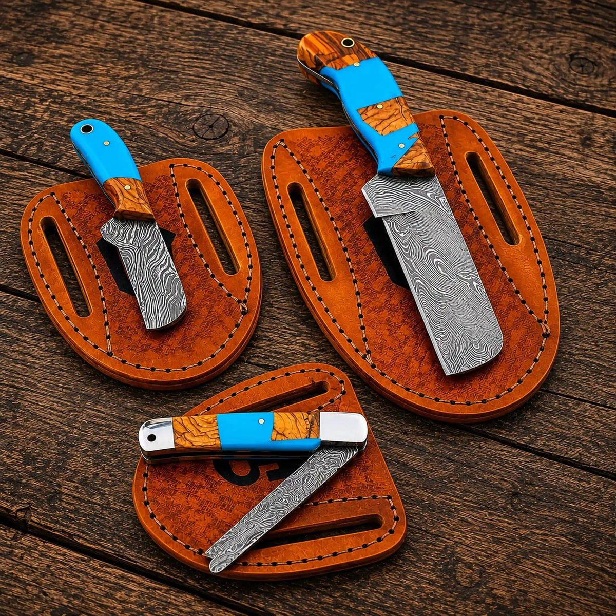 Set of cowboy knives with Damascus steel blades and turquoise handles in a western bull cutter knife collection by cskforged.