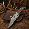 Western cowboy folding pocket knife by SHAM KNIVES with Damascus steel blade and compact wood handle, ideal for everyday carry.