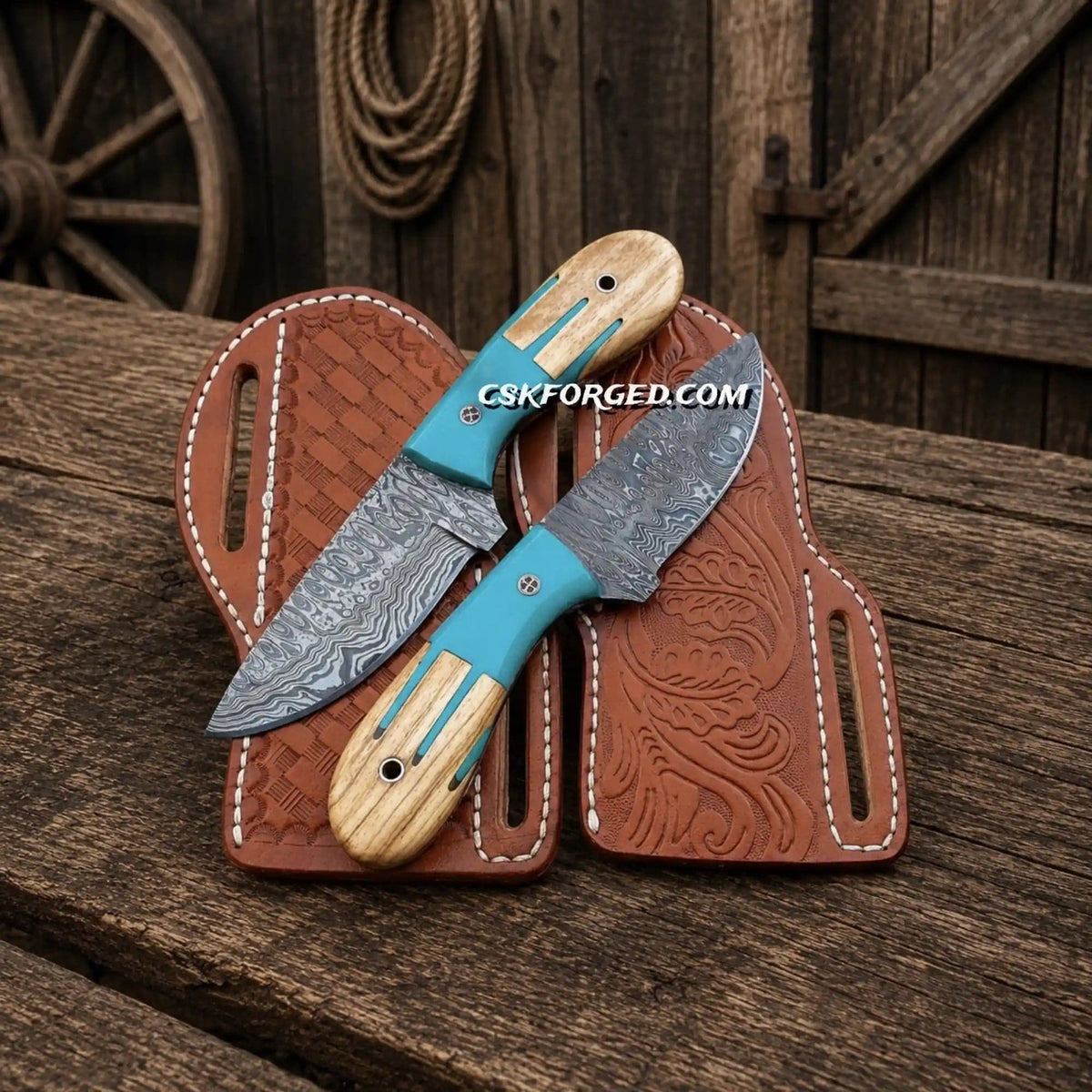 Set of cowboy skinning knives by cskforged with Damascus steel blades and blue Maverick handles, ideal for outdoor hunting tasks.