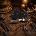 Western Ranch Skinning Knife by SHAM KNIVES with 4-inch copper Damascus blade, stag horn handle, and leather cross draw sheath.