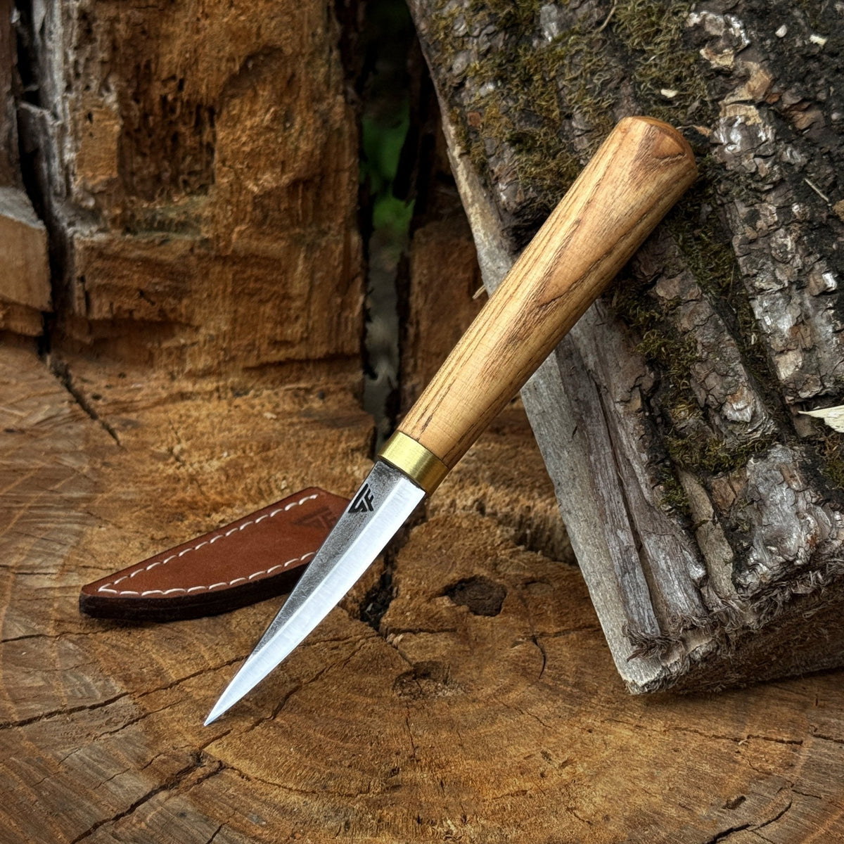 Sharky Forged Steel Sloyd Knife with 7.5 cm blade and leather sheath, ideal for whittling and wood carving.