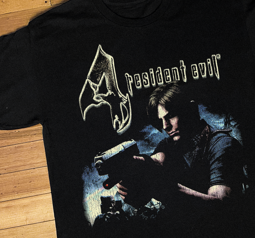 Black Resident Evil 4 PS2 T-shirt by Parallel showcasing a detailed graphic design on the front.